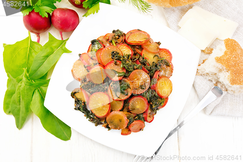 Image of Radish with spinach and spices in plate on light board top