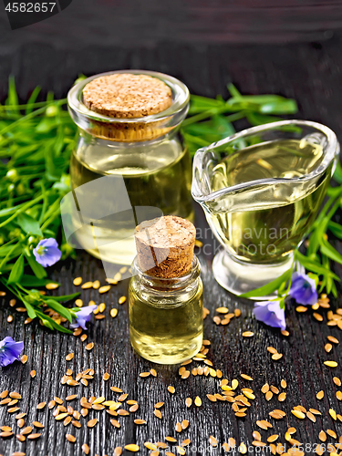 Image of Oil flaxseed on dark wooden board