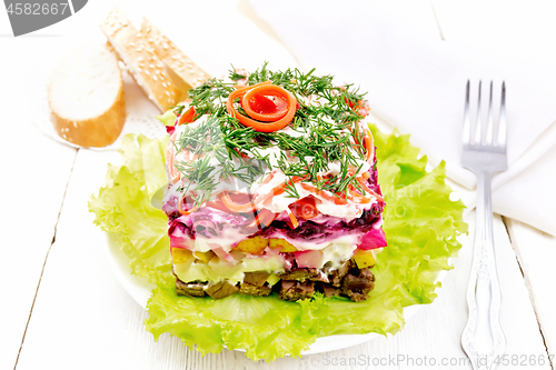 Image of Salad with beef and vegetables on light wooden board