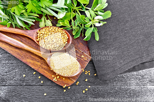 Image of Fenugreek in two spoons with herbs on board top