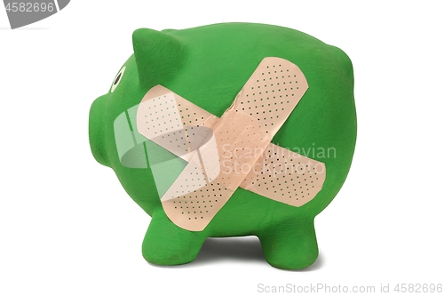 Image of Piggy bank with band-aid