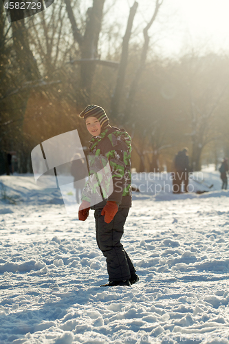 Image of Boy Sliding on Ice Rink