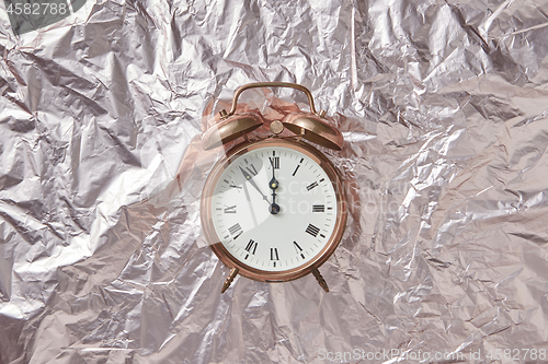 Image of Retro cooper alarmclock on abstract background.