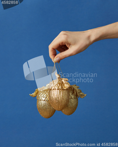 Image of Woman hand with Christmas decoration.