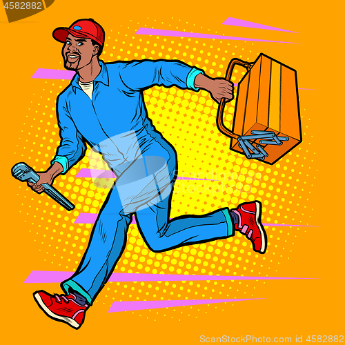 Image of Male African master repairman runs