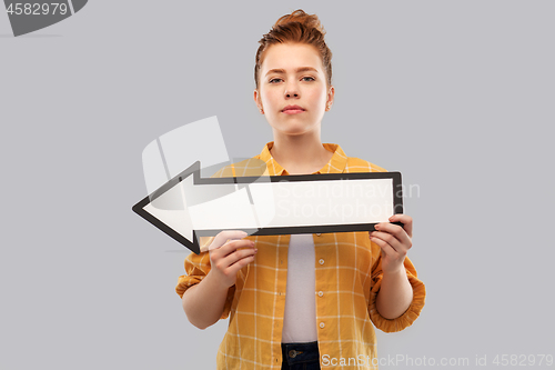 Image of red haired teenage girl with arrow showing to left