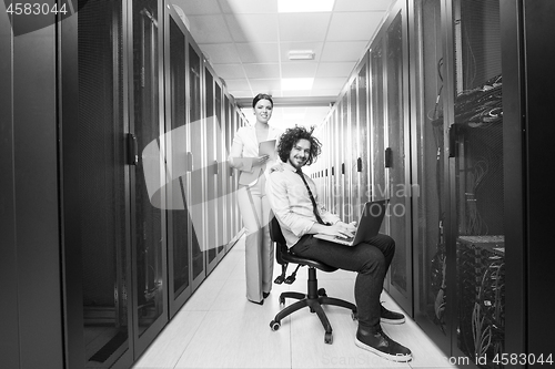 Image of Team of young technicians working together on servers