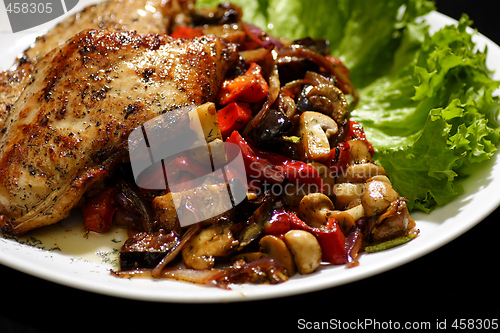 Image of pan fried chicken with roasted vegetables