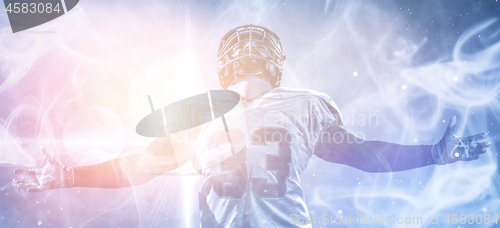 Image of american football player celebrating after scoring a touchdown