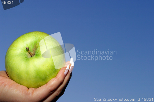 Image of apple against blue sky
