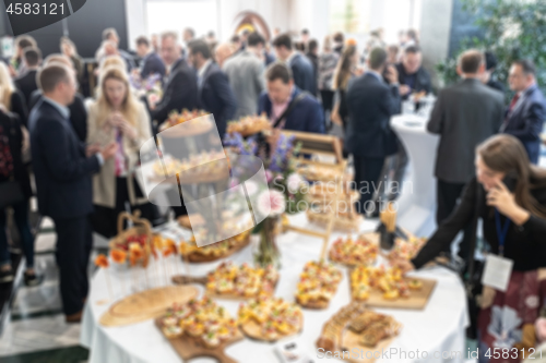 Image of Abstract blured photo of business people socializing during banquet lunch break break at business meetin, conference or event