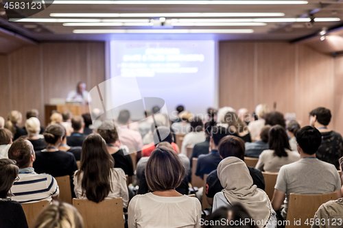 Image of Business speaker giving a talk at business conference event.