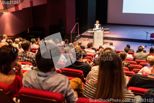 Image of Business speaker giving a talk at business conference event.