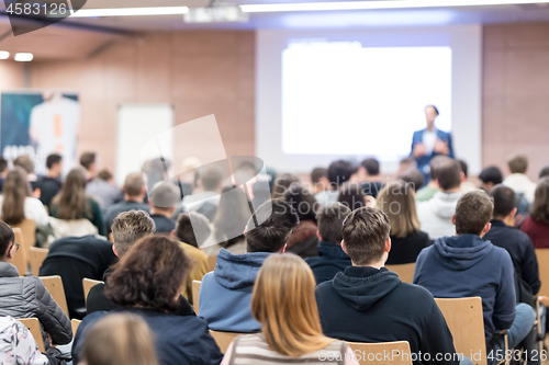 Image of Business speaker giving a talk at business conference event.