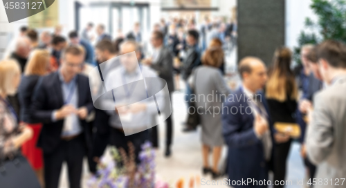 Image of Abstract blured photo of business people socializing during banquet lunch break break at business meetin, conference or event