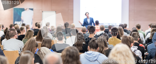 Image of Business speaker giving a talk at business conference event.