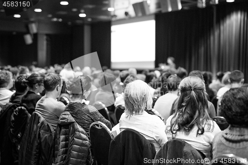 Image of Audience in the lecture hall attending scientific business conference.