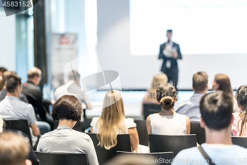 Image of Male business speaker giving a talk at business conference event.