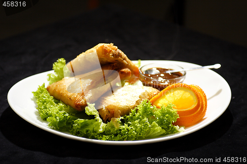 Image of samosa with plum sauce