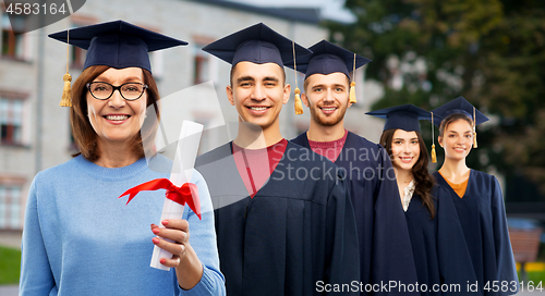 Image of happy senior graduate student woman with diploma