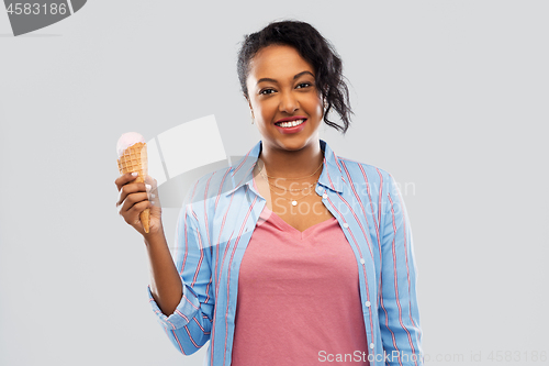 Image of happy african american woman with ice cream cone