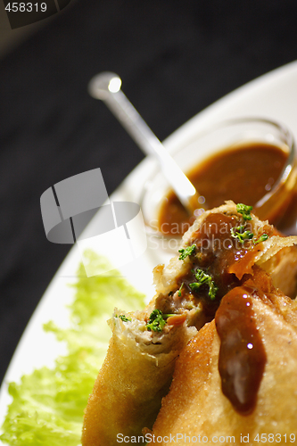 Image of samosa with plum sauce