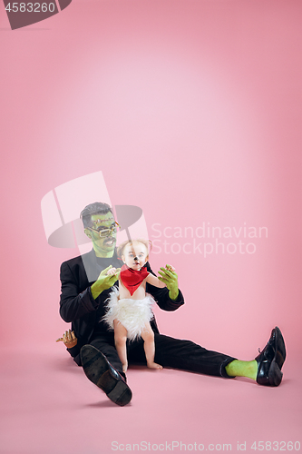 Image of Halloween Family. Happy Father and Children Girl in Halloween Costume and Makeup