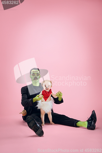 Image of Halloween Family. Happy Father and Children Girl in Halloween Costume and Makeup