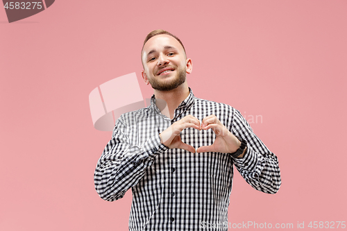 Image of Portrait of attractive man with kiss isolated over pink background