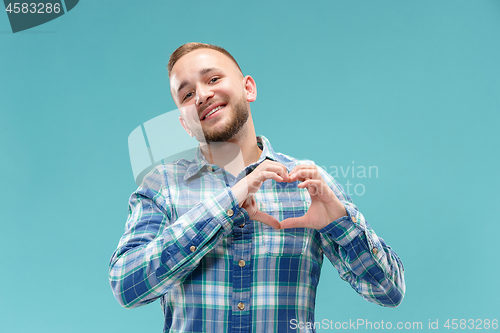 Image of Portrait of attractive man with kiss isolated over blue background