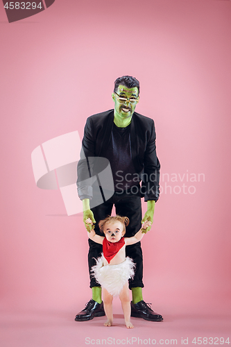 Image of Halloween Family. Happy Father and Children Girl in Halloween Costume and Makeup