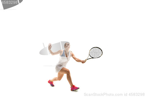 Image of Adult woman playing tennis. Studio shot over white.