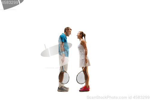 Image of caucasian man and woman as tennis players posing isolated on white background