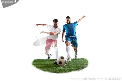 Image of Football players tackling for the ball over white background