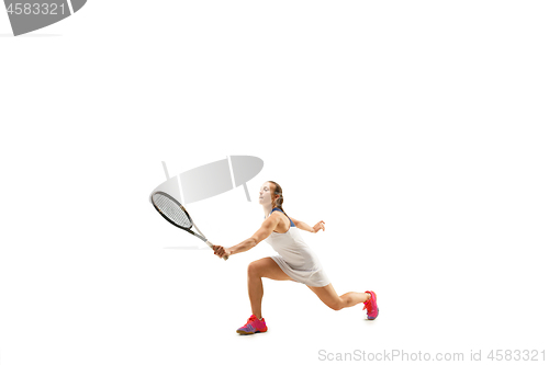 Image of Adult woman playing tennis. Studio shot over white.
