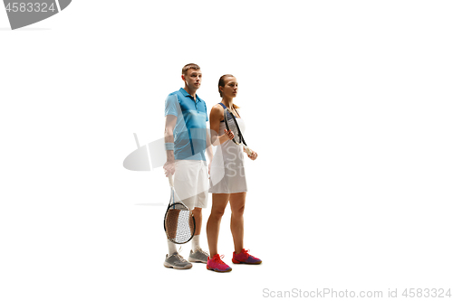 Image of caucasian man and woman as tennis players posing isolated on white background