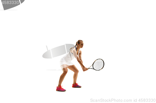 Image of Adult woman playing tennis. Studio shot over white.