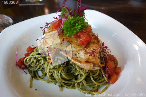 Image of Delicious spaghetti dish with spinach sauce