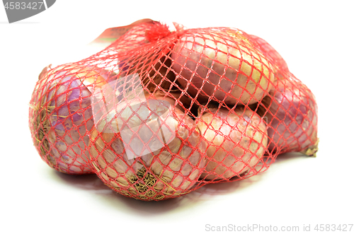 Image of Pack of red onions isolated