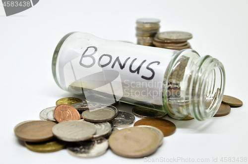 Image of Bonus lable in a glass jar with coins spilling out