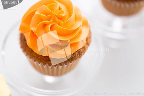 Image of cupcake with frosting on confectionery stand