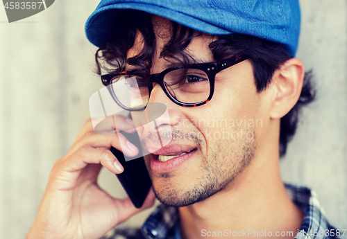 Image of close up of man calling on smartphone