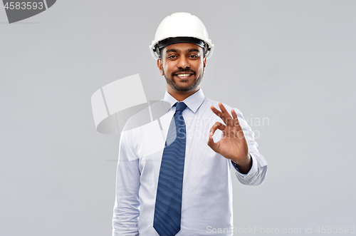 Image of architect or businessman in helmet showing ok