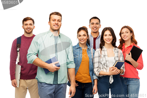 Image of group of smiling students with books
