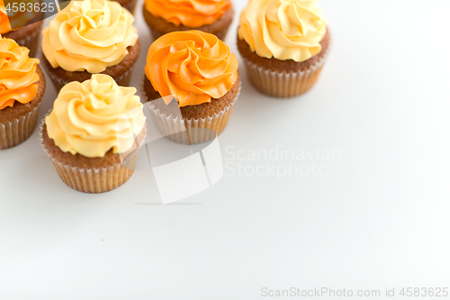 Image of cupcakes with frosting on white background