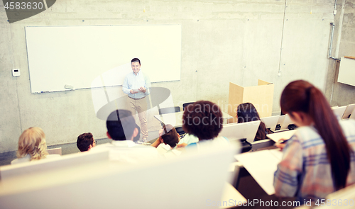 Image of group of students and teacher at lecture