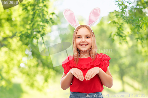 Image of happy girl wearing easter bunny ears headband