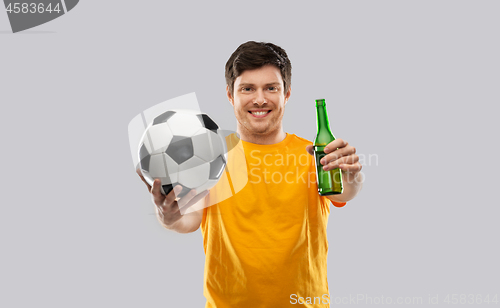 Image of man or football fan with soccer ball and beer