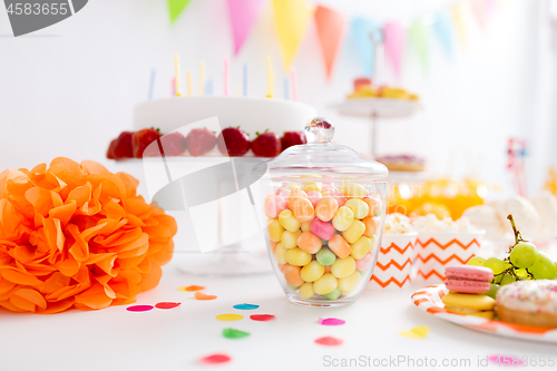 Image of glass jar with candy drops at birthday party