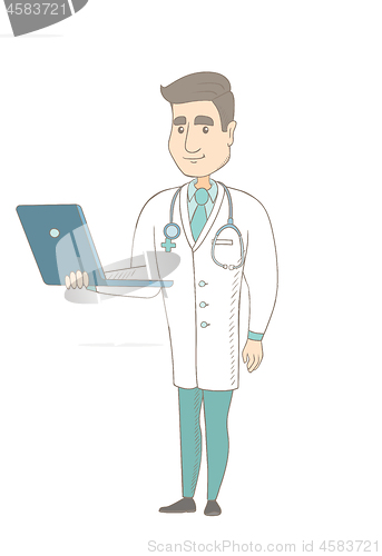 Image of Young caucasian doctor using a laptop.